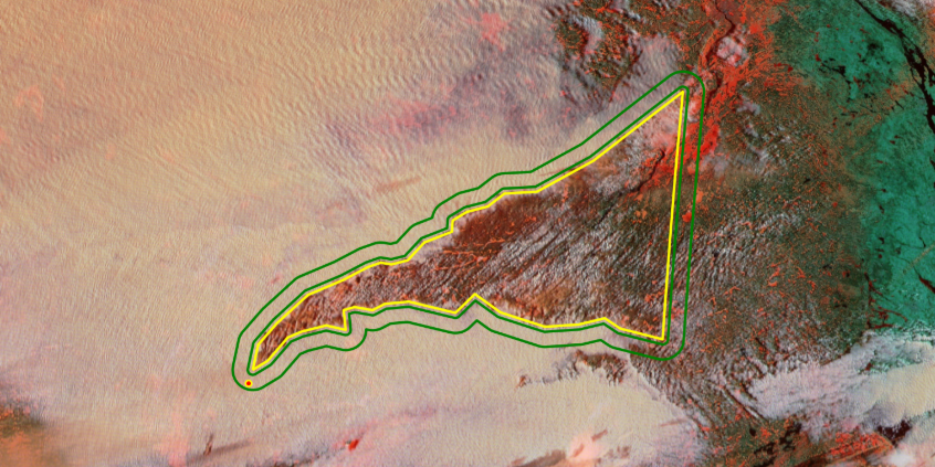 Satellite map view showing a jagged geographic zone outlined in bright yellow, with a parallel green border surrounding it over a textured red and tan landscape.